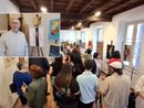 L'inaugurazione della mostra, nel riquadro Ferdinando Pagani accanto al suo autoritratto