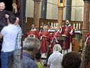 Don Lorenzo mentre celebra a destra e a lato mentre viene lanciato scherzosamente in aria (foto social dell'oratorio di Sant'Edoardo)
