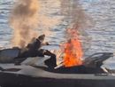 Le immagini della moto d'acqua in fiamme al pontile di Angera