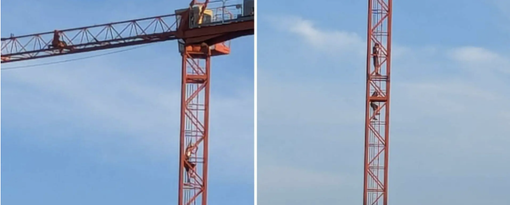 Saronno, entrano in un cantiere e si arrampicano su una gru