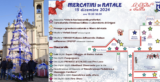 I MastrArtisti con l'albero e accanto la locandina della Pro Loco