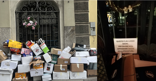 I rifiuti depositati davanti all'edicola e il cartello che chiede rispetto