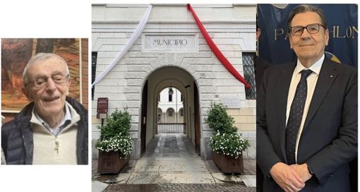 A sinistra Giavini, a destra Paglini: al centro il municipio &quot;vestito&quot; da patronale (foto da pagina Facebook Comune)