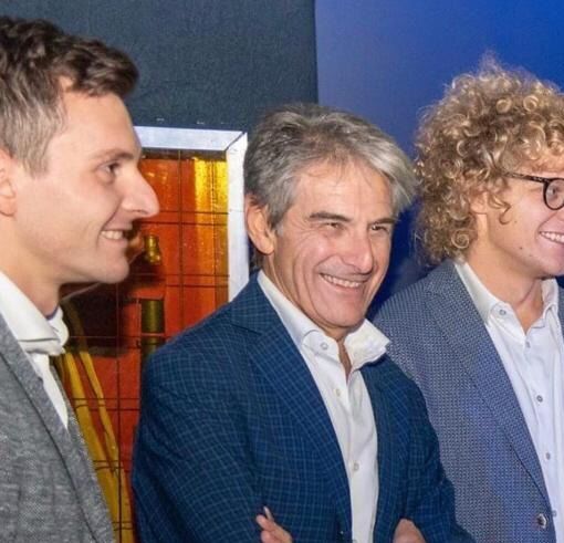 Angelo Tondini al centro con i figli Marco e Giorgio