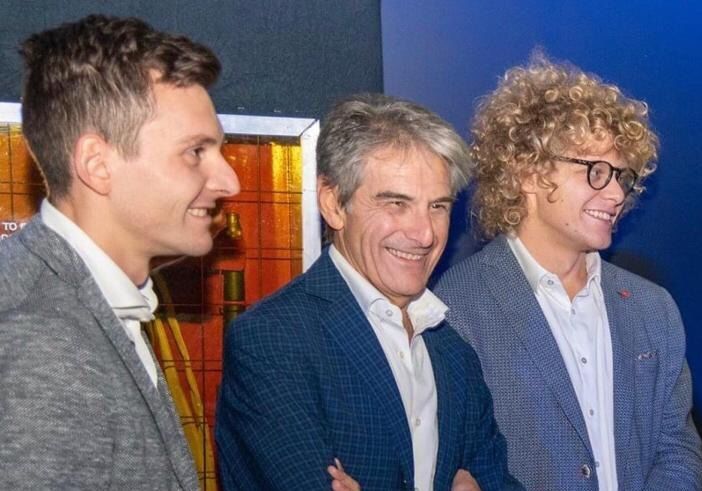 Angelo Tondini al centro con i figli Marco e Giorgio