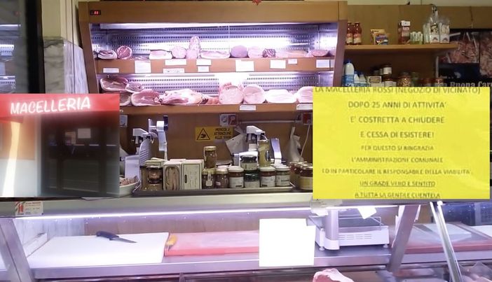 La macelleria Rossi e il cartello La macelleria Rossi e il cartello