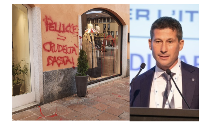 L'azione degli imbrattatori e a fianco il presidente di Confcommercio Busto Rudy Collini