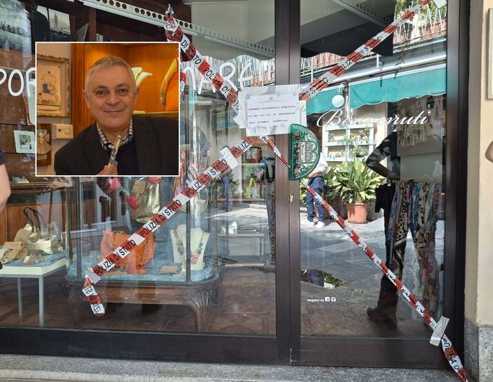 I sigilli alla porta del negozio in cui si è consumato il delitto. Nel riquadro, Davide Gorla