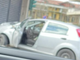 L'auto finita contro la saracinesca in via Varese (foto da un lettore)