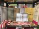 Una vetrina con le pubblicazioni e i simboli del Magistero dei Bruscitti nella cartoleria Tagliabue