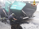 FOTO. Sesto Calende, macchina asfaltatrice finisce nella voragine in strada