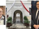 A sinistra Giavini, a destra Paglini: al centro il municipio &quot;vestito&quot; da patronale (foto da pagina Facebook Comune)
