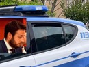 Marco Manfrinati portato via dalla polizia e nel riquadro al convegno di 7 anni fa