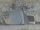 La tenda piazzata a Induno Olona, sotto il ponte della tangenziale